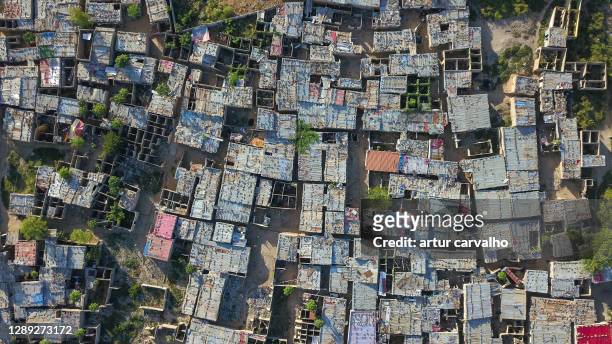 aerial view of slums in luanda, angola - slum africa stock pictures, royalty-free photos & images