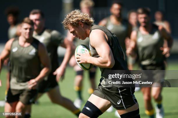 Ned Hanigan runs the ball during the Australian Wallabies captain's run at David Phillips Sports Complex on December 04, 2020 in Sydney, Australia.