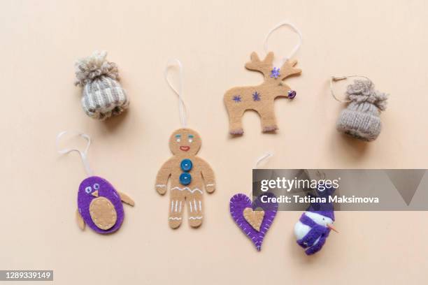 collection of handmade christmas objects viewed from above on blue background. - blue felt stock pictures, royalty-free photos & images