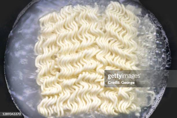 instant noodles in cooking pan,close up - instant noodles stock pictures, royalty-free photos & images