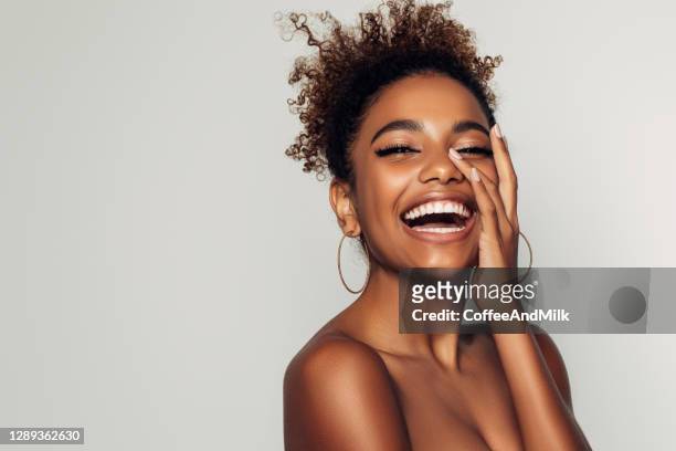 beautiful girl with curly hairstyle - toothy smile stock pictures, royalty-free photos & images