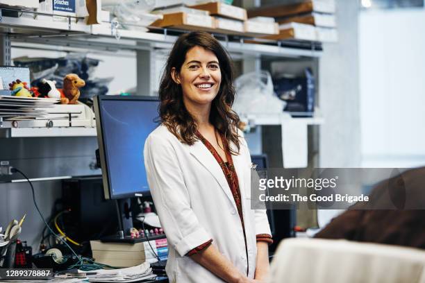 portrait of smiling female lab technician - medical laboratory stock pictures, royalty-free photos & images