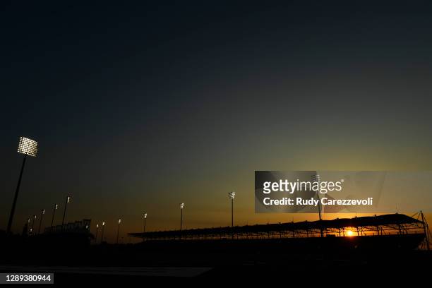 General view as the sun sets behind a grandstand during practice ahead of the F1 Grand Prix of Sakhir at Bahrain International Circuit on December...