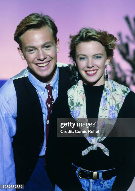 Jason Donovan and Kylie Minogue pose for Red Nose Day 1989 in the studio on 10 March in London.