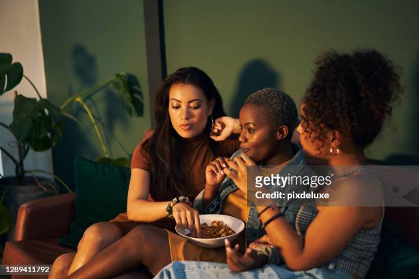tonight is all about the gossip and the snacks - girls' night in stock pictures, royalty-free photos & images