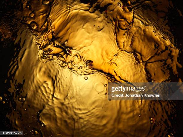 gold liquid - whiskey stock pictures, royalty-free photos & images