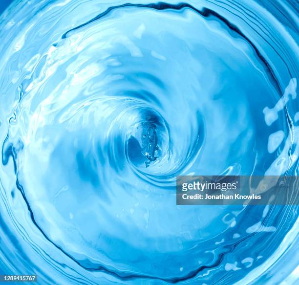 blue liquid vortex - wasser stock-fotos und bilder