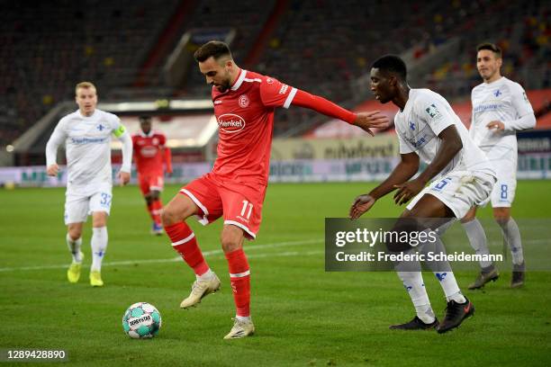 Duesseldorf's Kenan Karaman battles Darmstadts Patric Pfeiffer during the Second Bundesliga match between Fortuna Düsseldorf and SV Darmstadt 98 at...