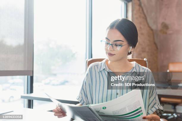 businesswoman reviews documents - instructions manual stock pictures, royalty-free photos & images