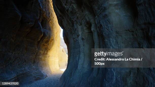 scenic view of cave entrance,alula,saudi arabia - cave stock pictures, royalty-free photos & images