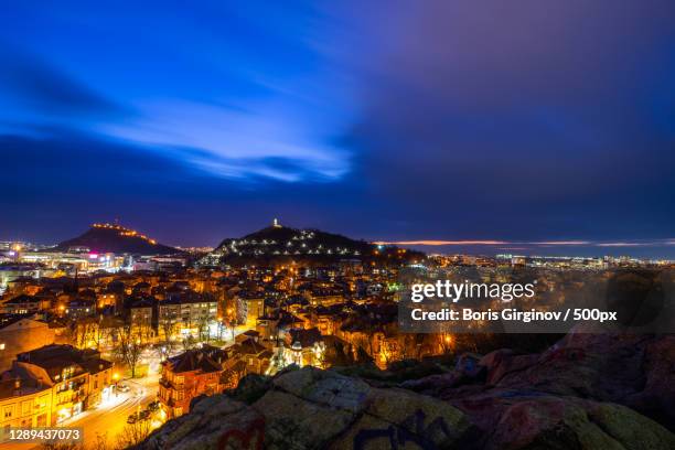 high angle view of illuminated buildings against sky at dusk,plovdiv,bulgaria - plovdiv stock pictures, royalty-free photos & images
