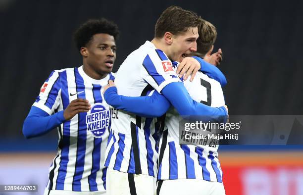 Peter Pekarik of Hertha celebrates his team's first goal with teammates Niklas Stark and Javairo Dilrosun during the Bundesliga match between Hertha...