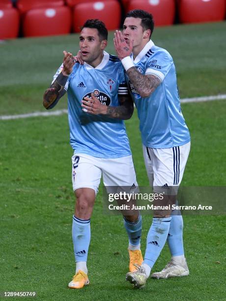 Hugo Mallo of Celta de Vigo celebrates his team's first goal with teammate Santi Mina during the La Liga Santander match between Athletic Club and RC...