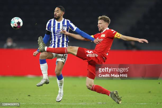 Matheus Cunha of Hertha is challenged by Marvin Friedrich of Union during the Bundesliga match between Hertha BSC and 1. FC Union Berlin at...