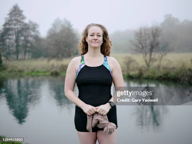 portrait of female swimmer in winter - studio portrait swimmer stock pictures, royalty-free photos & images