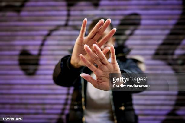 close-up of black woman gesturing refusal with her hands - rejection hand stock pictures, royalty-free photos & images