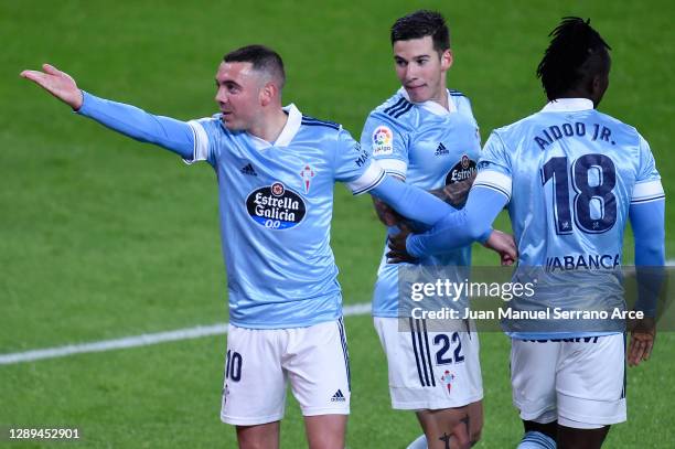 Iago Aspas of Celta de Vigo celebrates his team's second goal with teammates Santi Mina and Joseph Aidoo during the La Liga Santander match between...