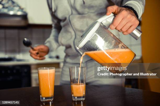 making fresh juice - vegetable juice stock pictures, royalty-free photos & images