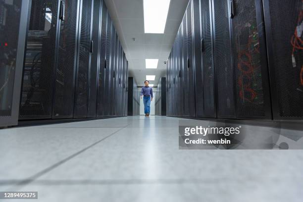 administrator working on a network server - super computer stock pictures, royalty-free photos & images