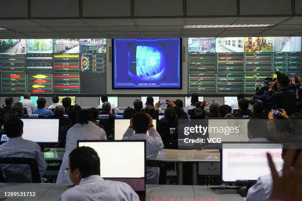 Scientists work at a control room as the China's nuclear fusion device 'HL-2M' tokamak, nicknamed the 'Artificial Sun', achieves its first plasma...