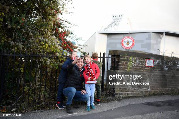 Brentford fans pose for a selfie outside the stadium prior to the Sky Bet Championship match between Brentford and Blackburn Rovers at Brentford...