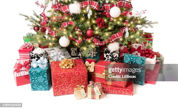 decorated christmas tree with gifts - christmas presents under tree stock pictures, royalty-free photos & images