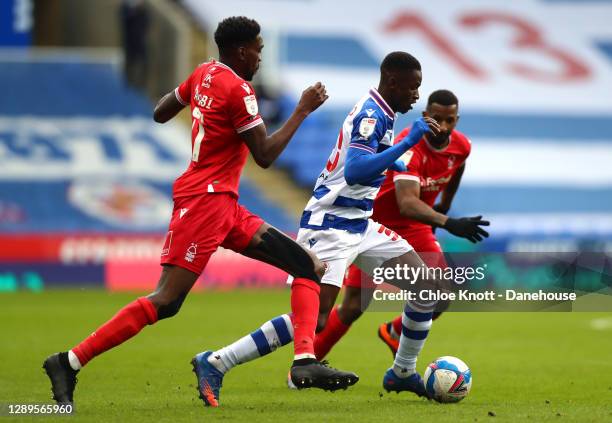 Sammy Ameobi of Nottingham Forest puts pressure on Alfa Semendo Esteves of Reading during the Sky Bet Championship match between Reading and...