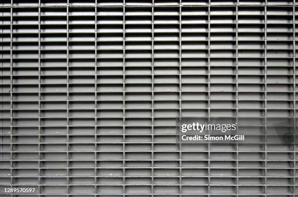 metal grid detail on a metal gate - metal grate stock pictures, royalty-free photos & images