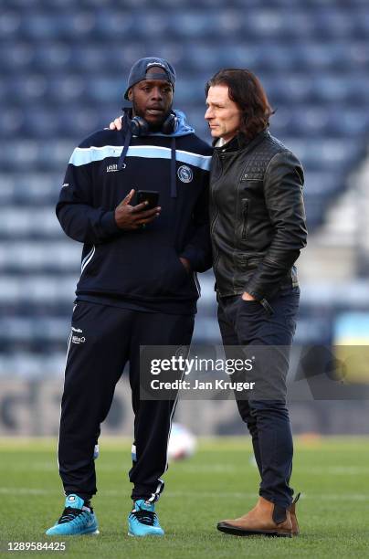 Wycombe Wanderers manager Gareth Ainsworth chats with Adebayo Akinfenwa before the game during the Sky Bet Championship match between Preston North...