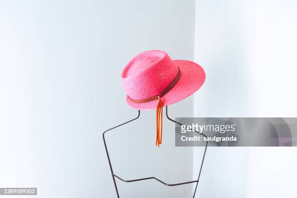 pink hat on a metallic mannequin - white hat fashion item stock pictures, royalty-free photos & images