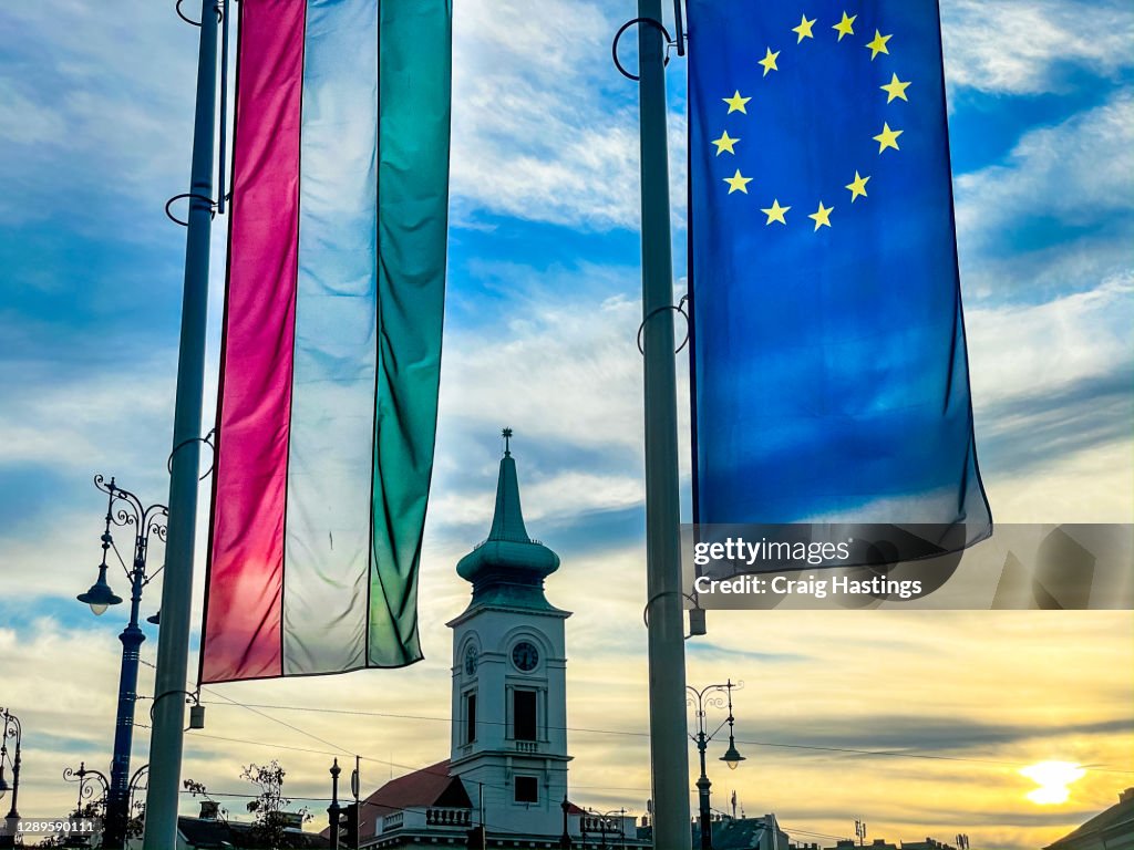 European Union and Hungarian flag amid a business corperate setting