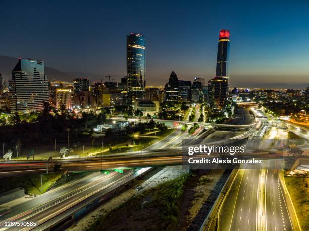 aerial view of santiago de chile at night - santiago chile sunset stock pictures, royalty-free photos & images