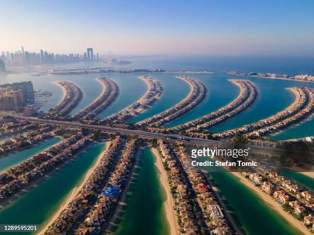 the palm jumeirah island in dubai uae aerial view - dubai stock pictures, royalty-free photos & images