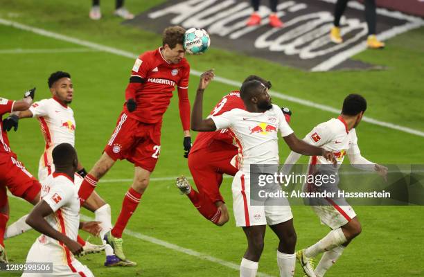 Thomas Mueller of FC Bayern Munich scores his team's third goal during the Bundesliga match between FC Bayern Muenchen and RB Leipzig at Allianz...