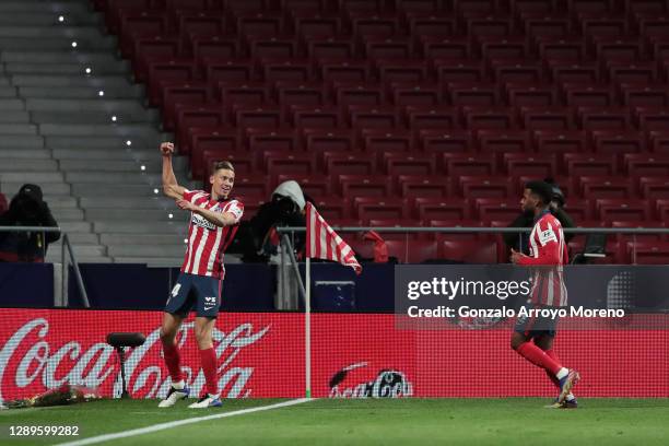 Marcos Llorente of Atletico de Madrid celebrates with team mate Thomas Lemar after scoring his sides second goal during the La Liga Santander match...