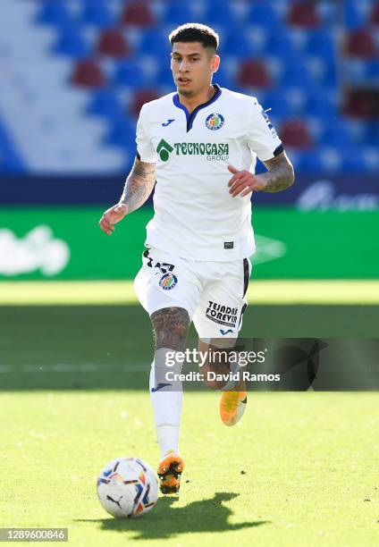 Mathias Olivera of Getafe CF runs with the ball during the La Liga Santander match between Levante UD and Getafe CF at Ciutat de Valencia Stadium on...