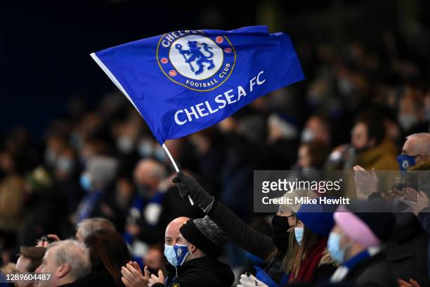 Chelsea fan is seen waving a flag prior to the Premier League match between Chelsea and Leeds United at Stamford Bridge on December 05, 2020 in...