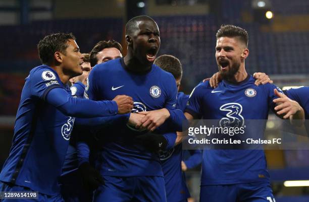 Kurt Zouma of Chelsea celebrates with teammates Thiago Silva and Olivier Giroud after scoring their team's second goal during the Premier League...