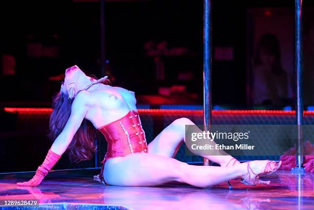 Cast member Agnes Roux dances during a performance of "Sexxy After Dark: Where Dinner Meets Play" at Larry Flynt's Hustler Club on December 3, 2020...