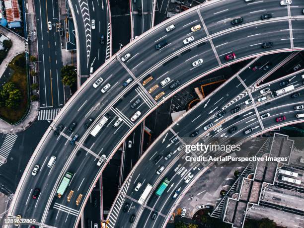 aerial view of busy road intersection and overpass - busy highway stock pictures, royalty-free photos & images