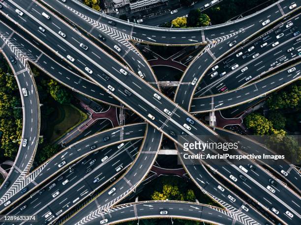 busy road intersection and overpass - rise above it stock pictures, royalty-free photos & images