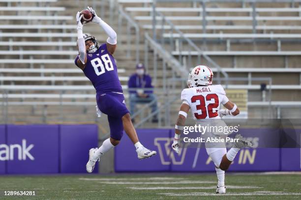 Ty Jones of the Washington Huskies completes a catch against Jonathan McGill of the Stanford Cardinal in the third quarter at Husky Stadium on...