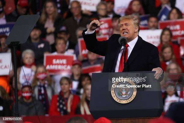 President Donald Trump attends a rally in support of Sen. David Perdue and Sen. Kelly Loeffler on December 05, 2020 in Valdosta, Georgia. The rally...