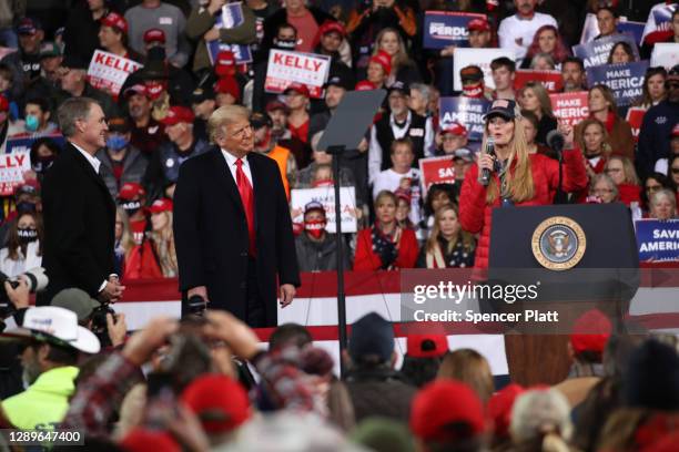 President Donald Trump attends a rally in support of Sen. David Perdue and Sen. Kelly Loeffler on December 05, 2020 in Valdosta, Georgia. The rally...