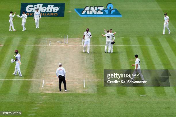 General view as Shannon Gabriel of the West Indies looks dejected after being dismissed by Neil Wagner of New Zealand, who is congratulated by Will...
