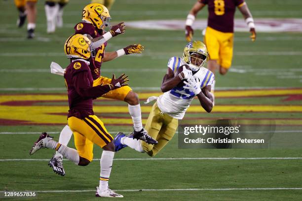 Wide receiver Delon Hurt of the UCLA Bruins catches a 38-yard reception against the Arizona State Sun Devils during the first half of the NCAAF game...
