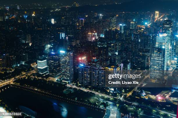 aerial view at night of cbd in guangzhou - emerging markets stockfoto's en -beelden