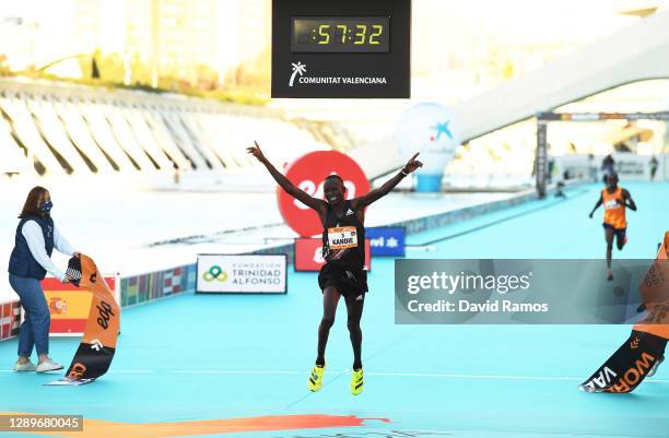 Kibiwott Kandie of Kenya breaks the Men’s Half Marathon World Record wearing the adidas adizero adios pro during the Valencia Marathon on December...