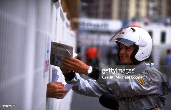 David Coulthard of Scotland and McLaren-Mercedes signs his autograph for the crowds David Coulthard of Scotland and McLaren-Mercedes signs his autograph for the crowds