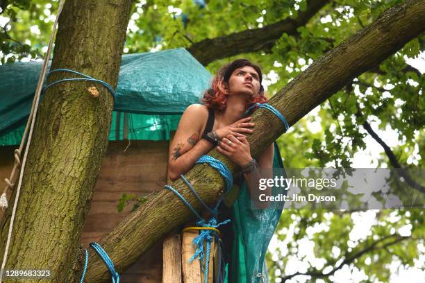 Environmental activist, Conner, poses for a portrait in Jones Hill Wood at a protest camp against the HS2 High Speed Rail line and its proposed route...